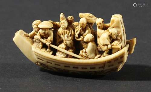 Japanese ivory netsuke,by ikkosai toun, edo period, carved as a boat full of