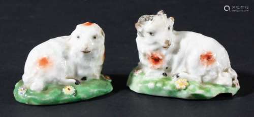 Pair of derby sheep,late 18th century, modelled recumbent on floral bases,