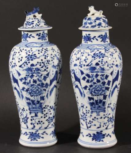 Pair of chinese blue and white vases and covers,kangxi style, of inverted