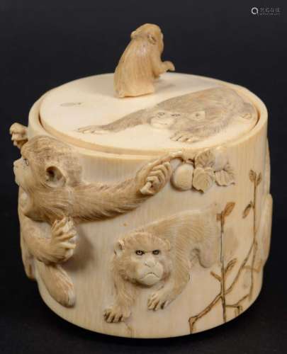 Japanese ivory box and cover,meiji, carved with monkeys eating fruit, with a