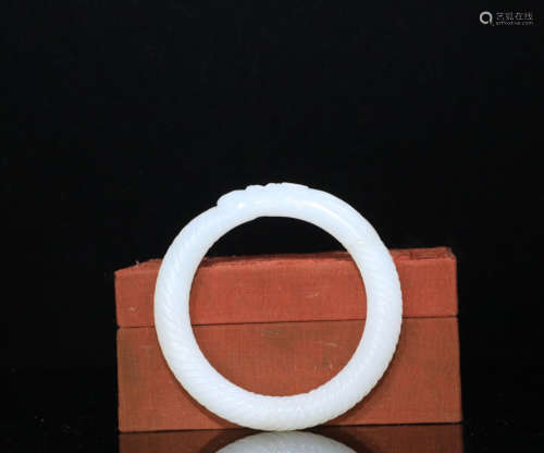 A HETIAN WHITE JADE CARVED BANGLE