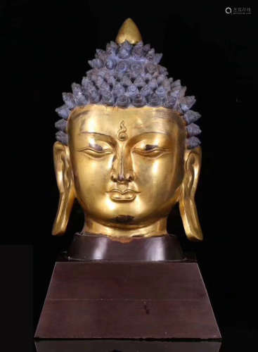 A TIBETAN GILT BRONZE SAKYAMUNI BUDDHA HEAD STATUE