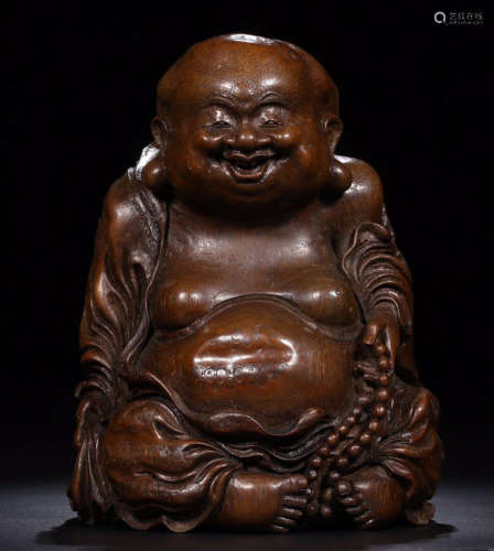 AN OLD BAMBOO CARVED LUOHAN FIGURE