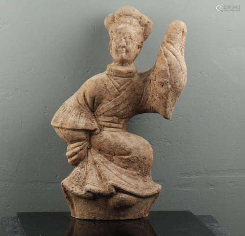 A DANCING LADY POTTERY FIGURE