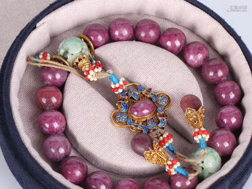 A RUBY GILT SILVER BEADS BRACELET