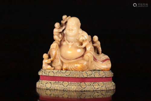 A SOAPSTONE CARVED LAUGHING BUDDHA FIGURE