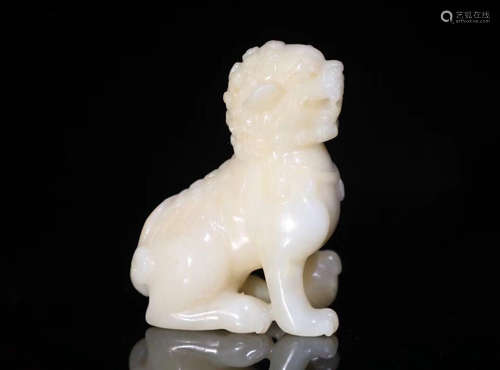 A LION SHAPED HETIAN JADE BEAST PENDANT