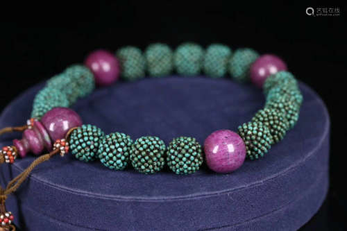 A TURQUOISE SMALL BEADS STRING BRACELET