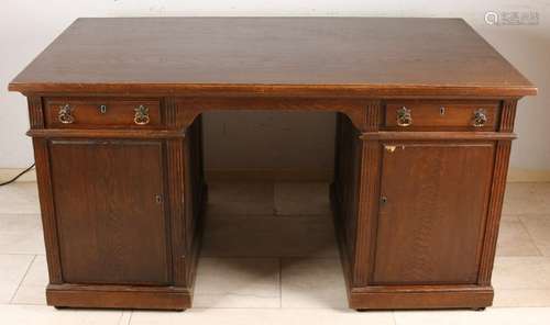 Antique oak writing desk with drawers behind the door.