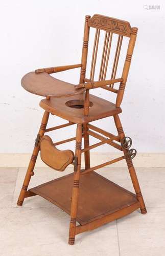 Antique beech wood doll chair with cast iron wheels.