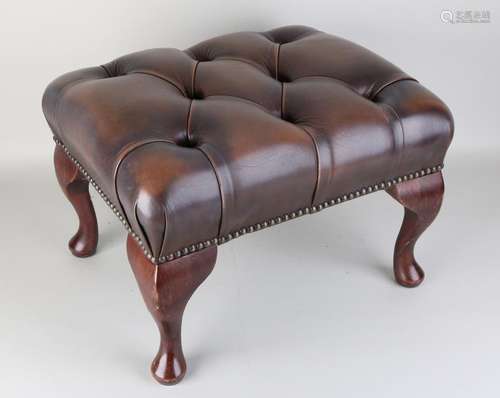 Leather Chesterfield footstool with copper nails.