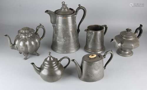 Six different antique pewter jugs with various marks.