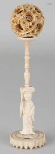 Antique Chinese ivory lucky charm on original standard.