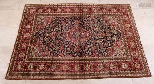 Old finely knotted Persian rug with floral decors.