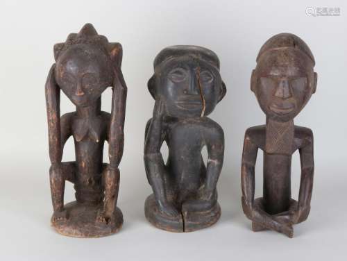 Three old wood-stoned African Zaire statues. Zuba