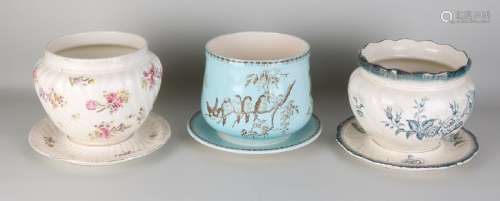 Three antique ceramic cache pots with drip trays.