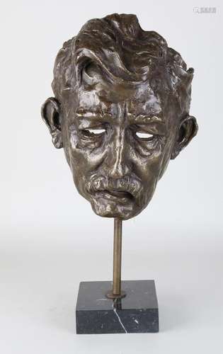 Large bronze mask, Albert Schweitzer, with black marble