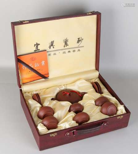 Chinese Yixing tea service in suitcase. 21st century.