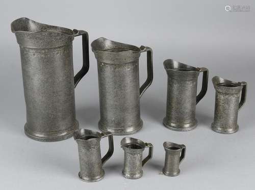 Antique seven-piece pewter gauge set. Approximately