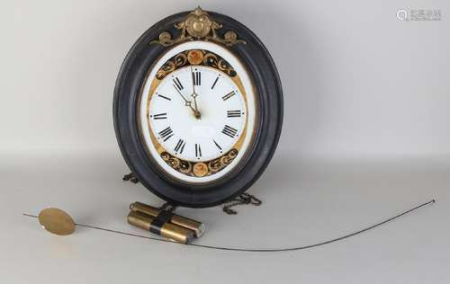 19th Century German Black Forest wall clock (oval).