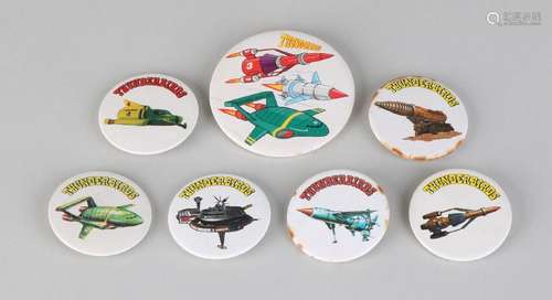 Seven buttons from the series Thunderbirds. 80er Years.