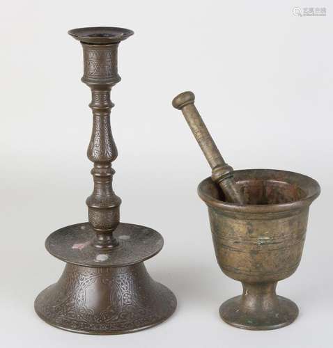 Antique bronze mortar and bronze skirt candlestick.