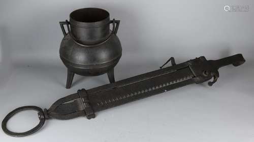 19th Century iron fetch and iron kettle on tripod.