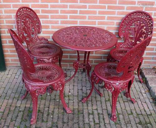 Five-piece metal openwork red garden set. 21st century.