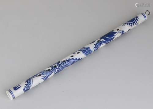 Old Chinese porcelain flute with dragons decor. Top