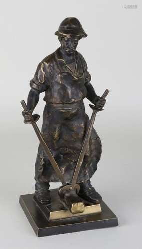 German, bronze patinated metal figure. Metal worker.