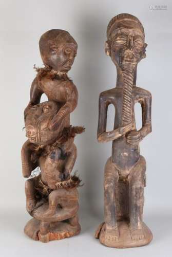 Two very large old wood carved African ritual figures.