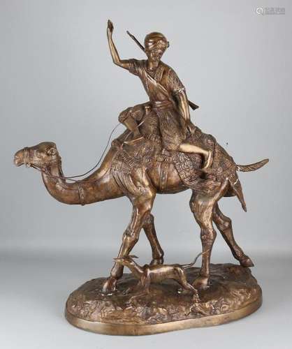 Large bronze camel with Arabian horseman. 20th century.