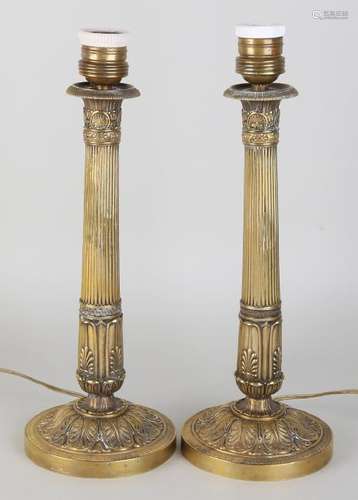 Two antique brass Empire-style lamp bases. Circa 1900.