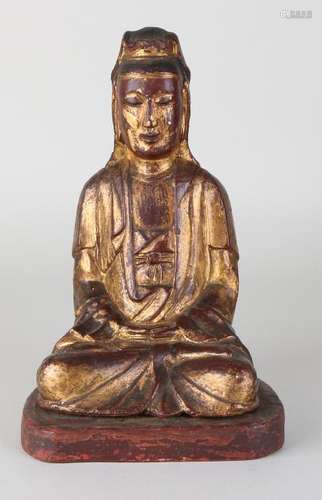 Antique gilded Chinese wood-stained buddha on console.