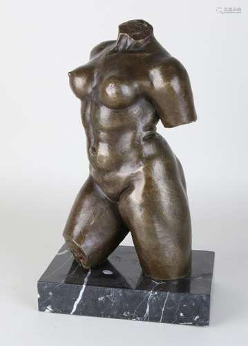 Bronze ladies torso. On black marble basement. Signed