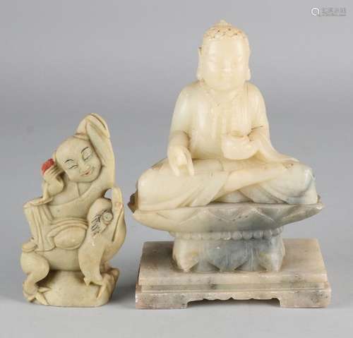 Two antique Chinese Oriental natural stone buddhas.