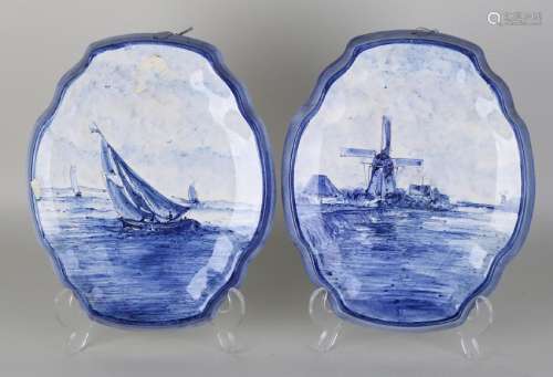 Two antique Delft Fayence wall plaques. Consisting of: