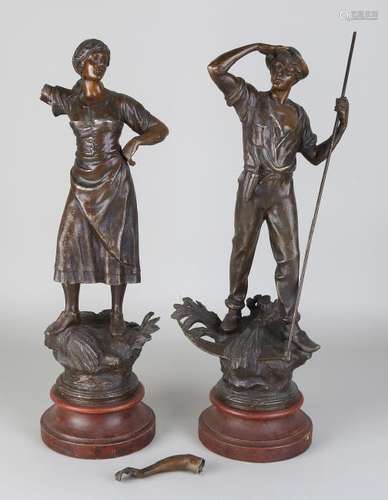 Two antique French composition metal statues. Farmer