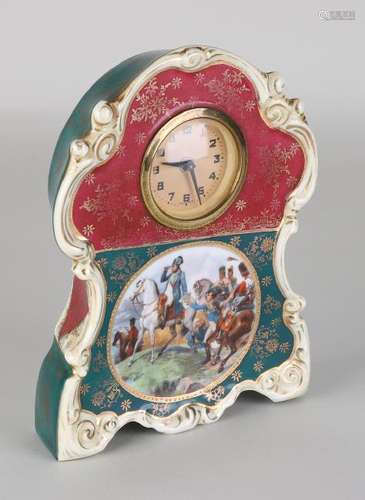 Antique German porcelain clock with Viennese decor.