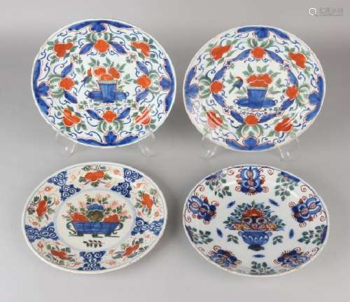 Four 18th century polychrome Delft plates with flower