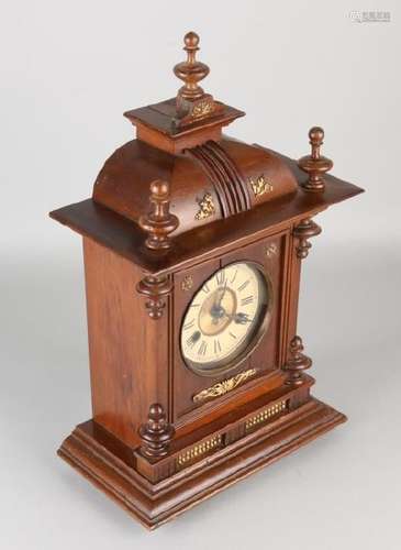 Antique walnut German table clock with gong strike.