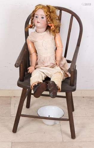 Large antique German porcelain doll with high chair.