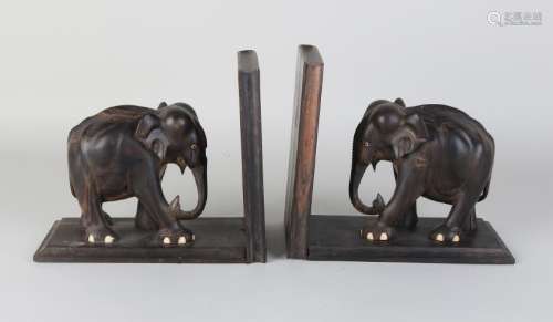 Two old tropical wooden bookends with Indian elephants