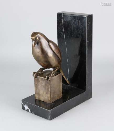 Art Deco style book support on black marble base. 21st