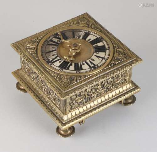 Old brass horizontal table clock. To 17th century