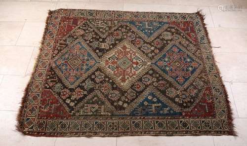 Old hand-knotted Persian carpet with floral and animal