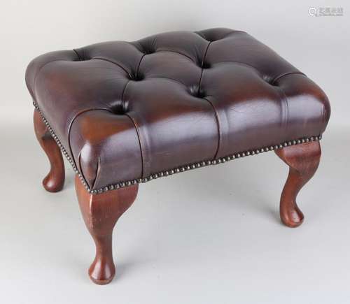 Leather Chesterfield footstool with copper nails.