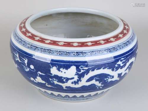 Old Chinese porcelain pot with dragon decor and soil