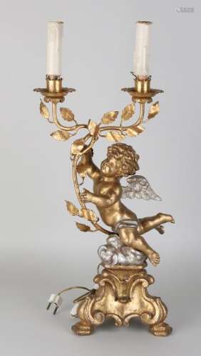 Old Italian gilded wood-stained lamp with angel. Old
