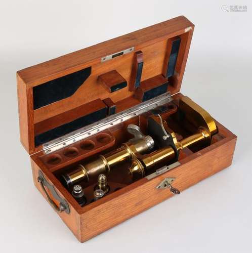 Antique German brass microscope in original wooden box.